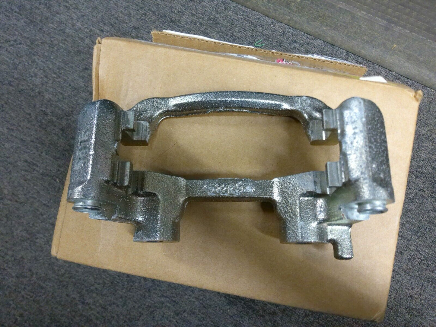 Genuine OEM GM 22705359 Bracket Rear Brake Caliper | CAVE15